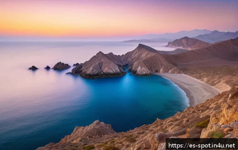 해남 땅끝마을 해돋이 - A serene sunrise scene at Mirador del Cabo de Gata in Almería, featuring dramatic volcanic cliffs ba...